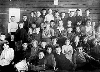 Teachers and students of the primary school in the village of Vederki